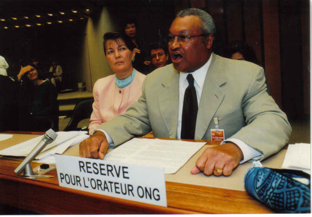 Conference photographer takes a picture of Mr. Silis Muhammad speaking before the Commission on Human Rights in 2000.